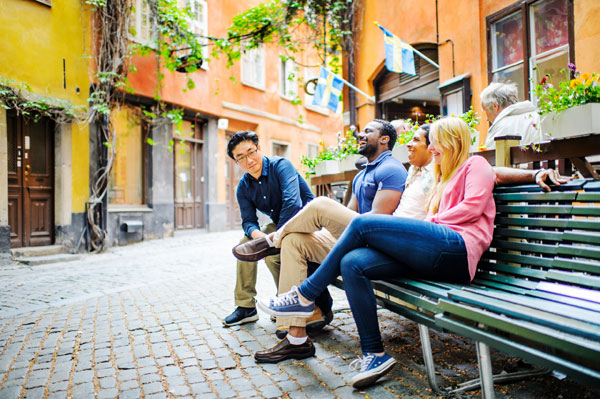 friends sitting on a bench in Stockholm