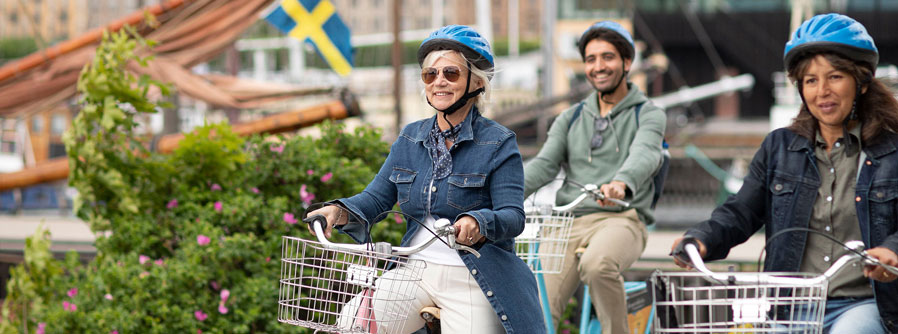 three people cycling